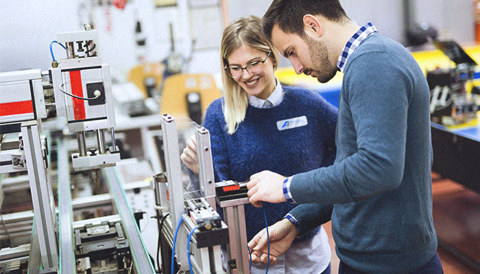 people maintaining equipment